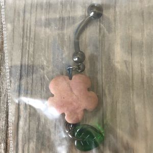 Flower with hanging leaf belly ring.